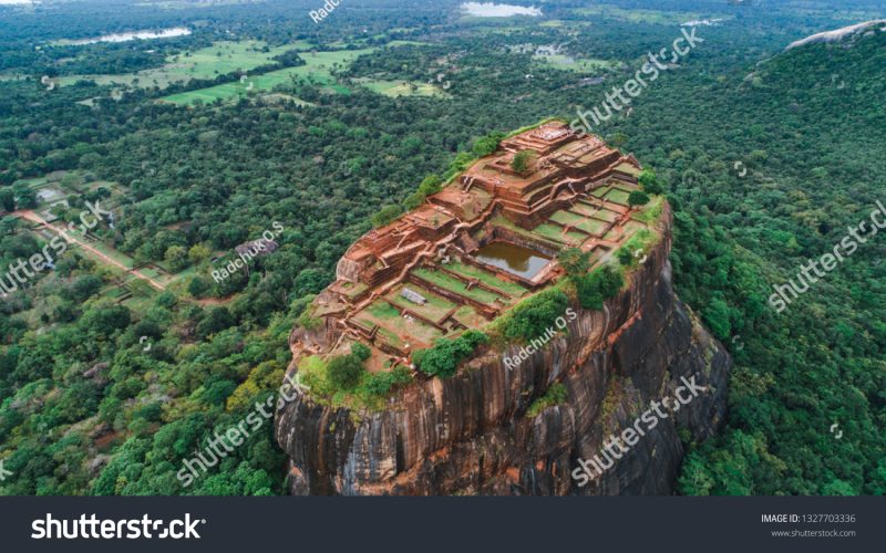 stock-photo-sigiriya-lion-s-rock-of-fortress-in-the-middle-of-the-forest-in-sri-lanka-island-1327703336